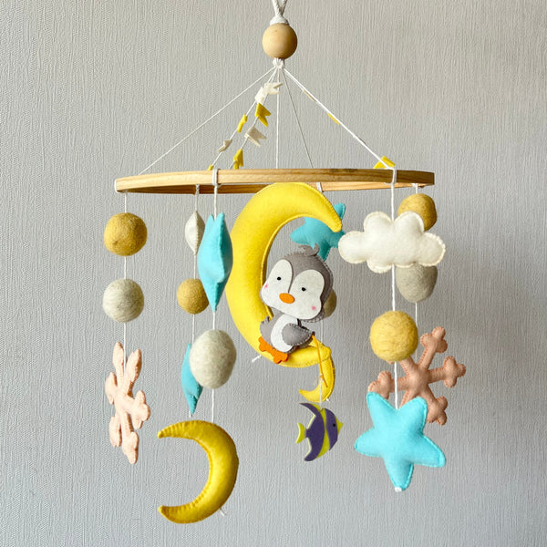 “Musical baby cot mobile with hanging toys and soothing lullaby for newborn crib or nursery”