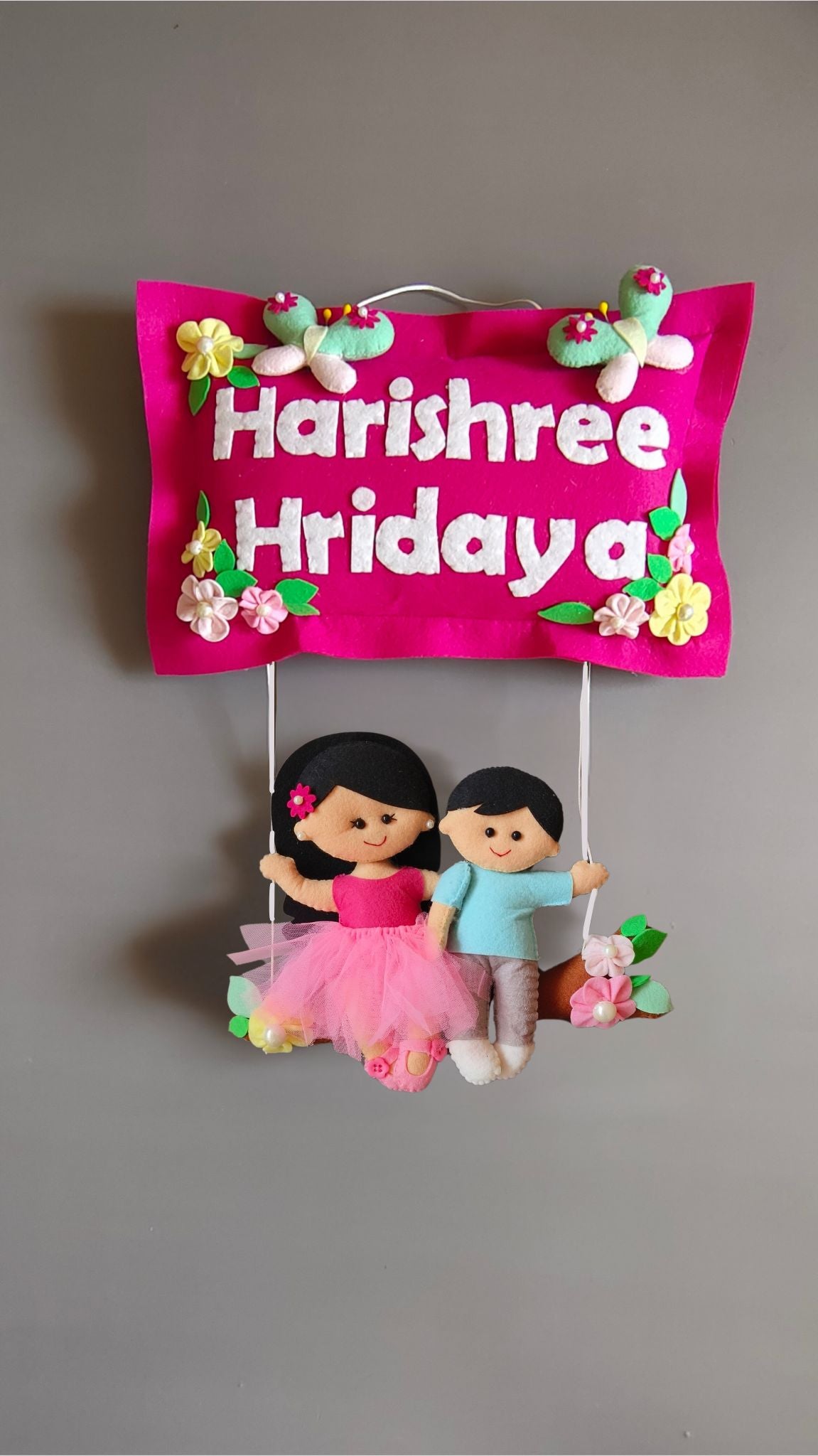 Siblings on swing  Customized Name Plate Wall Hanging