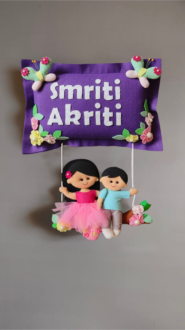 Siblings on swing  Customized Name Plate Wall Hanging